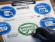 Invoice on clipboard with four blue verification stamps (Registry, Validity, Scope, Invoice Claim) and a green “Approved — Audit Ready” stamp.
