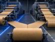 Stylized kraft paper roll feeding two converting lines, one running smoothly and one showing web instability.