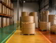 Warehouse storage risk map with kraft paper rolls in safe, caution, and high-risk zones near a loading dock.