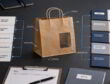 Kraft paper bag on a desk linking sustainability claims to proof folders in a claim-to-documentation matrix.