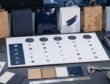 Procurement desk with paper bag finish samples, swatches, and a comparison matrix for coatings and handling trade-offs